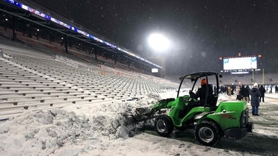 Field crew member clears snow off the field during the game between the Northwestern Wildcats and the Illinois Fighting Illini at Memorial Stadium on November 29, 2025 in Champaign, Illinois. (Getty Images via AFP) Field crew member clears snow off the field during the game between the Northwestern Wildcats and the Illinois Fighting Illini at Memorial Stadium on November 29, 2025 in Champaign, Illinois. (Getty Images via AFP)