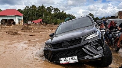 A car stuck in the mud at a village affected by flash flooding, in Agam, West Sumatra, Indonesia, Sunday, Nov. 30, 2025. (AP Photo/Ade Yuandha) (AP) A car stuck in the mud at a village affected by flash flooding, in Agam, West Sumatra, Indonesia, Sunday, Nov. 30, 2025. (AP Photo/Ade Yuandha) (AP)