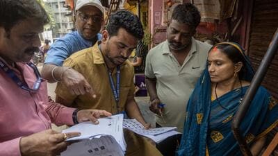 iMumbai, India - November 24, 2025: A campaign to verify voters whose names appear twice in the electoral rolls has begun today ahead of the upcoming elections. Municipal staff in Mumbai are visiting households to conduct this verification in Mumbai, India, on Tuesday, November 25 2025. (Photo by Satish Bate/ Hindustan Times) (Hindustan Times) iMumbai, India - November 24, 2025: A campaign to verify voters whose names appear twice in the electoral rolls has begun today ahead of the upcoming elections. Municipal staff in Mumbai are visiting households to conduct this verification in Mumbai, India, on Tuesday, November 25 2025. (Photo by Satish Bate/ Hindustan Times) (Hindustan Times)