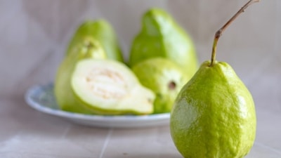 A single guava offers five times more Vitamin C than an orange. (Representative image/Unsplash) A single guava offers five times more Vitamin C than an orange. (Representative image/Unsplash)