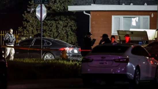 Investigators with the San Joaquin Sheriff's Department stand near the site of a deadly shooting at a home in Stockton, California, on Sunday, November 30, 2025. (AP)