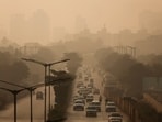 Vehicles move along a road on a smoggy morning, as air pollution persists in Mumbai.
