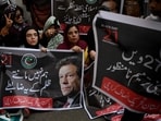 Pakistan Tehreek-e-Insaf (PTI) party supporters carry a poster of their leader and former Prime Minister Imran Khan, during a protest., Pakistan Tehreek-e-Insaf (PTI) party supporters carry a poster of their leader and former Prime Minister Imran Khan, during a protest.,