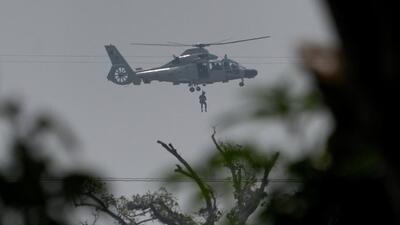 A Pakistan Navy helicopter airlifts a man who was stuck in a flooded area following Cyclone Ditwah in Kolonnawa, Sri Lanka, on Monday. (REUTERS) A Pakistan Navy helicopter airlifts a man who was stuck in a flooded area following Cyclone Ditwah in Kolonnawa, Sri Lanka, on Monday. (REUTERS)