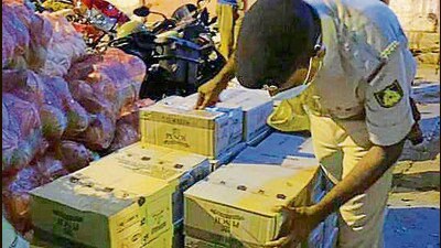 A policeman checking seized fake liquor consignments (HT FILE) A policeman checking seized fake liquor consignments (HT FILE)