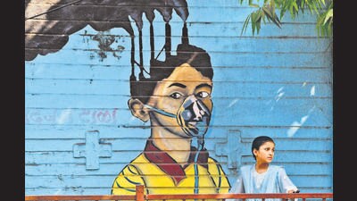 Mumbai, India – 01, Dec 2025: A pedestrian walk past a mural, made to create awareness, on the eve of the World Pollution Day, in Mumbai, India, on Monday, Dec 01, 2025. (Photo by Bhushan Koyande/HT Photo) Mumbai, India – 01, Dec 2025: A pedestrian walk past a mural, made to create awareness, on the eve of the World Pollution Day, in Mumbai, India, on Monday, Dec 01, 2025. (Photo by Bhushan Koyande/HT Photo)