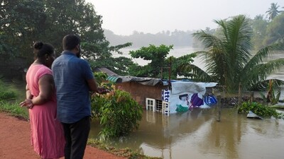 People look towards a house partially submersed by the flood, following Cyclone Ditwah in Peliyagoda, Sri Lanka, December 1, 2025. (Reuters)