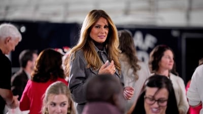 First lady Melania Trump attends a Red Cross holiday care packages making event inside a hangar on December 1, 2025, at Joint Base Andrews, Maryland. The event is part of the American Red Cross Service to the Armed Forces (SAF), which supports the military, veterans and their families (Getty Images via AFP) First lady Melania Trump attends a Red Cross holiday care packages making event inside a hangar on December 1, 2025, at Joint Base Andrews, Maryland. The event is part of the American Red Cross Service to the Armed Forces (SAF), which supports the military, veterans and their families (Getty Images via AFP)