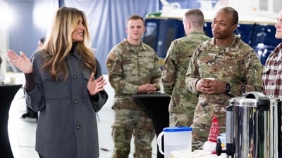 US First Lady Melania Trump speaks with members of the military after making care packages for deployed members of the US military during an American Red Cross holiday event with military families at Joint Base Andrews in Maryland, December 1, 2025 (AFP) US First Lady Melania Trump speaks with members of the military after making care packages for deployed members of the US military during an American Red Cross holiday event with military families at Joint Base Andrews in Maryland, December 1, 2025 (AFP)