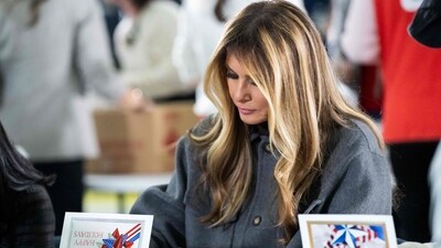 US First Lady Melania Trump writes a note to place into a care package for deployed members of the US military during an American Red Cross holiday event with military families at Joint Base Andrews in Maryland, December 1, 2025 (AFP) US First Lady Melania Trump writes a note to place into a care package for deployed members of the US military during an American Red Cross holiday event with military families at Joint Base Andrews in Maryland, December 1, 2025 (AFP)
