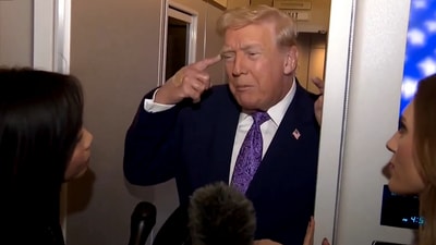 Donald Trump answering questions about his recent health scans, aboard Air Force One. (Reuters) Donald Trump answering questions about his recent health scans, aboard Air Force One. (Reuters)