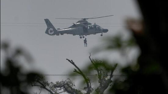 A Pakistan Navy helicopter airlifts a man who was stuck in a flooded area following Cyclone Ditwah in Kolonnawa, Sri Lanka, on Monday. (REUTERS)