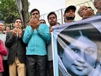 File photo of activists in support of Bangladesh's former prime minister Khaleda Zia, hold a banner with her portrait as they pray for her recovery in front of the Evercare Hospital in Dhaka. 