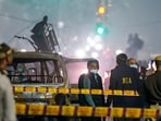 National Investigation Agency (NIA) team at the spot after a blast occurred in a parked car near Red Fort, leaving multiple vehicles in flames, in New Delhi, Monday, Nov. 10, 2025. 