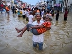 A youth carries an elderly man as they wade through a flooded street after heavy rainfall in Wellampitiya on the outskirts of Colombo. The floods and landslides were triggered by Cyclone Ditwah. A youth carries an elderly man as they wade through a flooded street after heavy rainfall in Wellampitiya on the outskirts of Colombo. The floods and landslides were triggered by Cyclone Ditwah.