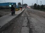 The pothole-ridden main road in Sector-37C and 37D in Gurugram as seen on Tuesday. (Parveen Kumar/HT Photo) The pothole-ridden main road in Sector-37C and 37D in Gurugram as seen on Tuesday. (Parveen Kumar/HT Photo)