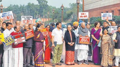 Congress’s Sonia Gandhi, Rahul Gandhi, Mallikarjun Kharge, and Priyanka Gandhi, with other opposition MPs, protest against SIR in Parliament premises on the second day of the winter session, in New Delhi on Tuesday. (ANI) Congress’s Sonia Gandhi, Rahul Gandhi, Mallikarjun Kharge, and Priyanka Gandhi, with other opposition MPs, protest against SIR in Parliament premises on the second day of the winter session, in New Delhi on Tuesday. (ANI)