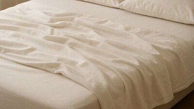 Soft folds rest across a tidy bed as fitted bedsheets create a neat look that feels warm, simple and ready for the evening. (AI generated) Soft folds rest across a tidy bed as fitted bedsheets create a neat look that feels warm, simple and ready for the evening. (AI generated)