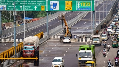 Vehicles pass by a closed section of the Delhi-Dehradun Expressway, in New Delhi. (PTI File) Vehicles pass by a closed section of the Delhi-Dehradun Expressway, in New Delhi. (PTI File)