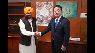 Punjab CM Bhagwant Mann with Komori Takuo, Parliamentary Vice-Minister of Economy, Trade and Industry, on Tuesday. (PTI)