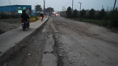 The pothole-ridden main road in Sector-37C and 37D in Gurugram as seen on Tuesday. (Parveen Kumar/HT Photo) The pothole-ridden main road in Sector-37C and 37D in Gurugram as seen on Tuesday. (Parveen Kumar/HT Photo)
