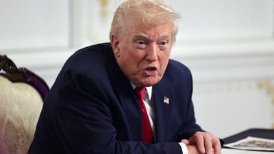 FILE PHOTO: U.S. President Donald Trump speaks with members of the media following a call with military service members, on Thanksgiving, in Palm Beach, Florida, U.S., November 27, 2025. REUTERS/Anna Rose Layden/File Photo (REUTERS)