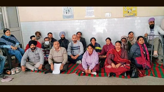 National Health Mission staff during a protest at Ludhiana civil hospital on Tuesday. (HT Photo)