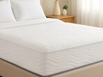 Fresh bedding, soft light and a well-maintained mattress create a tidy setting that feels inviting, restful and ready for a comfortable night.(Ai Generated)