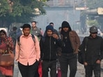 People wearing warm cloths during cold weather at Tilak Bridge railway station near ITO in New Delhi, India. (Photo by Arvind Yadav/ Hindustan Times) People wearing warm cloths during cold weather at Tilak Bridge railway station near ITO in New Delhi, India. (Photo by Arvind Yadav/ Hindustan Times)