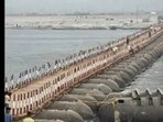 Workers building a pontoon bridge that will interlink different sectors of the Magh Mela-2024 tent city on the banks of Sangam in Prayagraj (File Photo) Workers building a pontoon bridge that will interlink different sectors of the Magh Mela-2024 tent city on the banks of Sangam in Prayagraj (File Photo)