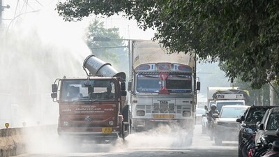 Gram it: Anti-smog guns can be spotted across NCR as these are part of the preventive measures being taken to reduce air pollution in in the Capital. Here's a view of how these guns were recently spraying fine droplets of water from vehicles, in Noida's Sector 67. The air quality across Gautam Buddha Nagar deteriorated sharply on Tuesday, with both Noida and Greater Noida slipping back into the 'very poor' category after a brief improvement at the start of the week. According to the Central Pollution Control Board (CPCB), Noida's AQI climbed to 374, while Greater Noida recorded 371. (Photo: Sunil Ghosh/HT)