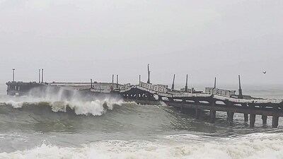 A bridge collapse due to strong winds and high tides triggered by Cyclone Ditwah, in Puducherry (ANI Video Grab) A bridge collapse due to strong winds and high tides triggered by Cyclone Ditwah, in Puducherry (ANI Video Grab)