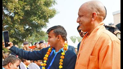 Chief minister Yogi Adityanath getting a selfie clicked during an event in Lucknow on the occasion of World Disability Day on Wednesday. (HT Photo) Chief minister Yogi Adityanath getting a selfie clicked during an event in Lucknow on the occasion of World Disability Day on Wednesday. (HT Photo)