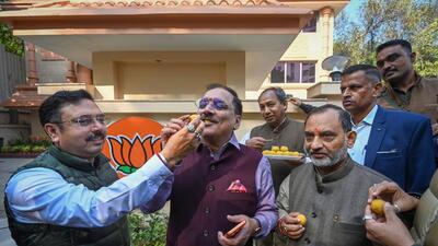 Delhi BJP leaders celebrate with sweets the victory in Municipal Corporation of Delhi on Wednesday. (Sanchit Khanna/HT Photo) Delhi BJP leaders celebrate with sweets the victory in Municipal Corporation of Delhi on Wednesday. (Sanchit Khanna/HT Photo)