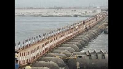 Workers building a pontoon bridge that will interlink different sectors of the Magh Mela-2024 tent city on the banks of Sangam in Prayagraj (File Photo) Workers building a pontoon bridge that will interlink different sectors of the Magh Mela-2024 tent city on the banks of Sangam in Prayagraj (File Photo)