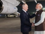 Modi greeted Putin as he emerged from his official aircraft and stepped onto the red carpet on a winter night . (AP) Modi greeted Putin as he emerged from his official aircraft and stepped onto the red carpet on a winter night . (AP)