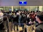 Passengers crowd outside a boarding gate as they wait to board a delayed IndiGo flight at Indira Gandhi International Airport in New Delhi. (Reuters) Passengers crowd outside a boarding gate as they wait to board a delayed IndiGo flight at Indira Gandhi International Airport in New Delhi. (Reuters)
