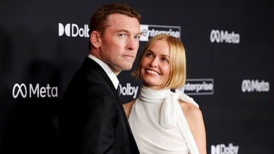 Cast member Sam Worthington and his wife Lara Worthington attend the premiere for the film 'Avatar: Fire and Ash', in Los Angeles, California, U.S. December 1, 2025 (REUTERS)