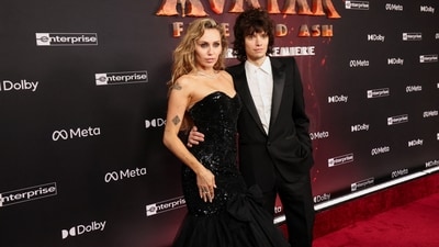 Miley Cyrus and Maxx Morando attend the premiere for the film 'Avatar: Fire and Ash', in Los Angeles, California, U.S., December 1, 2025. (REUTERS)