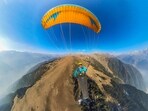 A participant during a paragliding fest organised by Jawahar Institute of Mountaineering and Winter Sports at Aru valley in Anantnag district. (PTI) A participant during a paragliding fest organised by Jawahar Institute of Mountaineering and Winter Sports at Aru valley in Anantnag district. (PTI)