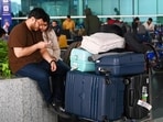 Air passengers at the T1 terminal of Indira Gandhi International Airport (IGIA), New Delhi, after the mass cancellation of IndiGo flights on Friday. (Vipin Kumar/HT)
