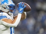 Detroit Lions wide receiver Amon-Ra St. Brown plays against the Dallas Cowboys despite injury Thursday, Dec. 4, 2025, in Detroit. (AP Photo/Ryan Sun)