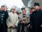 National Conference president Farooq Abdullah with his chief minister Omar Abdullah and others pay tribute to party founder Sheikh Mohammad Abdullah on his 120th birth anniversary at Naseem Bagh, Hazratbal, in Srinagar on Friday. (ANI)