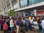 Passengers waited in queues to enquire about flight status at several airports across India amid IndiGo flight disruptions on Friday, December 5, 2025. Passengers waited in queues to enquire about flight status at several airports across India amid IndiGo flight disruptions on Friday, December 5, 2025.