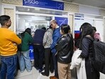 Passengers line up at the IndiGo counter at IGI Airport’s Terminal 2, in New Delhi on Thursday. (Sanjeev Verma/HT PHOTO)
