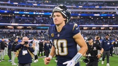Los Angeles Chargers quarterback Justin Herbert (10) walks off the field after an NFL football game against the Las Vegas Raiders (AP) Los Angeles Chargers quarterback Justin Herbert (10) walks off the field after an NFL football game against the Las Vegas Raiders (AP)
