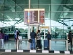 IndiGo flights cancelled flights highlights: Passengers wait at Terminal 1 of the Indira Gandhi International Airport as IndiGo’s flight disruptions continue nationwide, in New Delhi on Saturday.