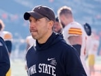 Matt Campbell of the Iowa State Cyclones heads off the field after 20-13 win over the Oklahoma State Cowboys 