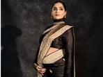 Sonam Kapoor made heads turn at the Swadesh flagship store launch in Mumbai, flaunting her baby bump in a stunning black and gold Banarasi saree designed by Abu Jani Sandeep Khosla. (Instagram/ Sonam Kapoor)