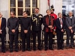 Chief of the Naval Staff Admiral Dinesh Kumar Tripathi, Congress MP Shashi Tharoor and other dignitaries during a state banquet at Rashtrapati Bhavan, in New Delhi, Friday, Dec. 5, 2025. 